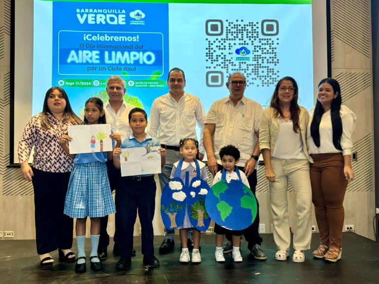 Grupo de personas y niños en la conmemoración del Día Internacional del Aire Limpio.